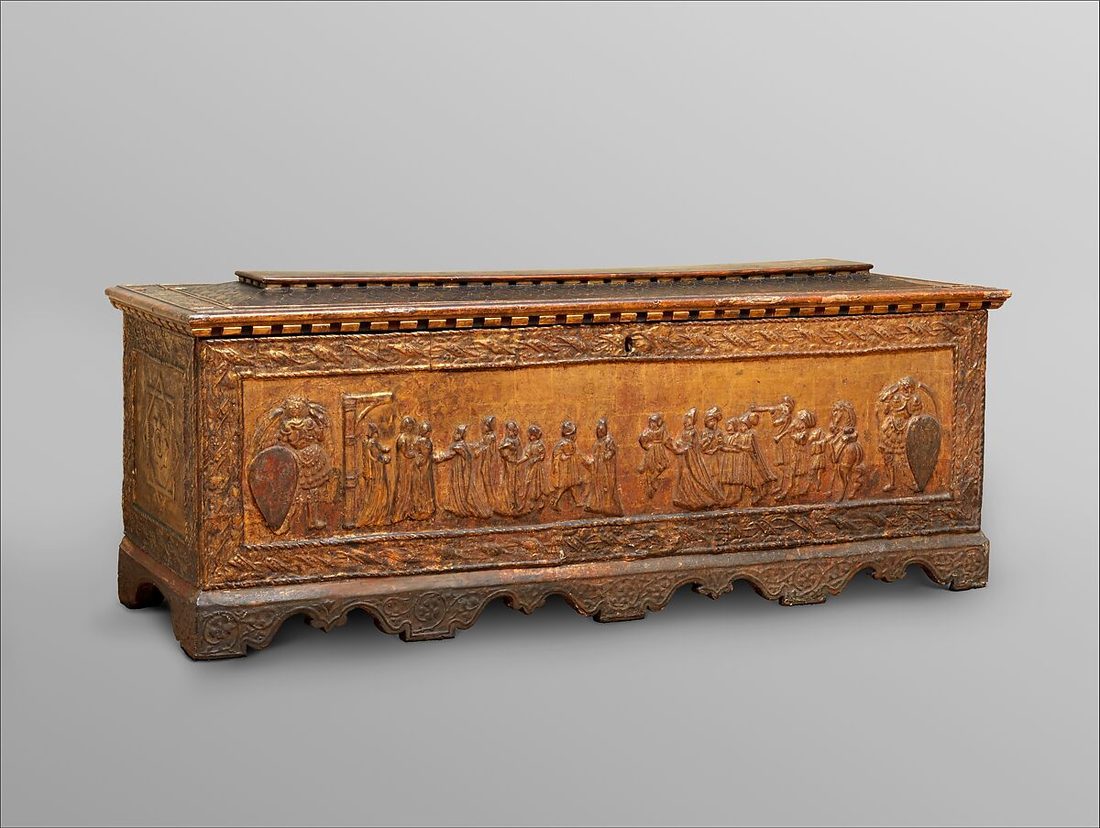 Gilded walnut cassone with a carved procession in low relief, Florence, mid-15th century