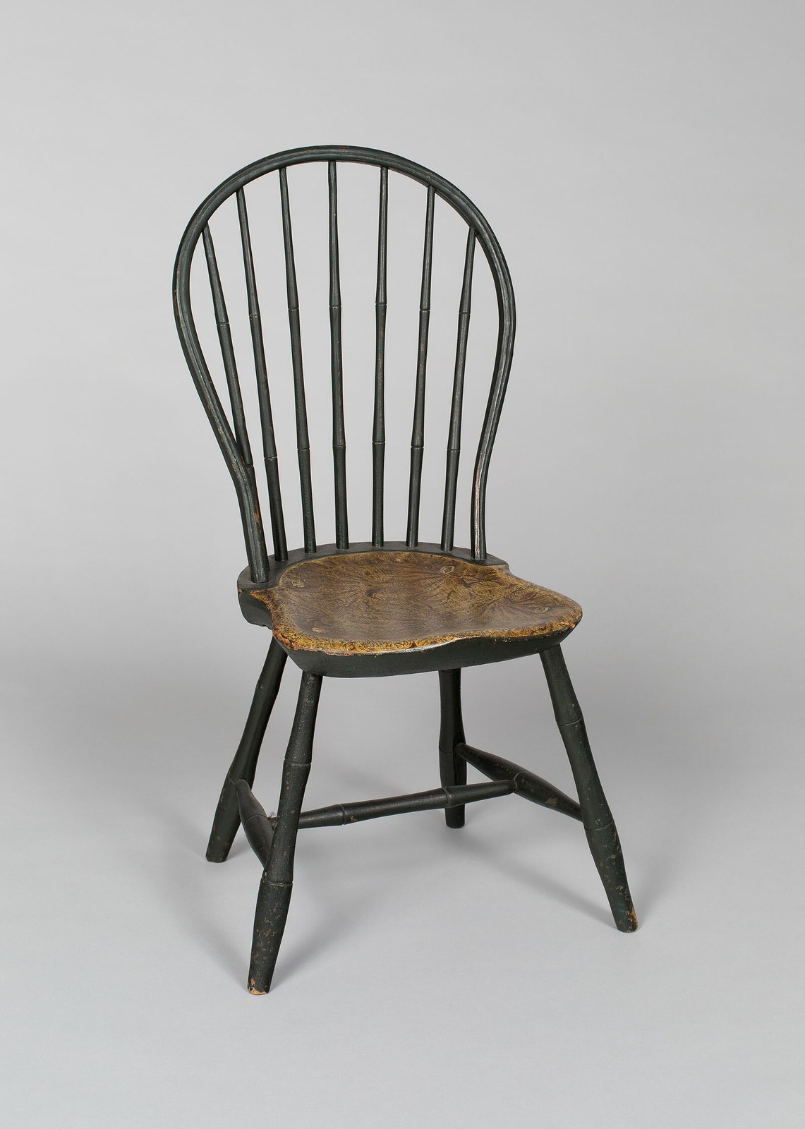Bow-back Windsor side chair with bamboo-turned spindles and worn dark-green paint, American, c. 1800 to 1825